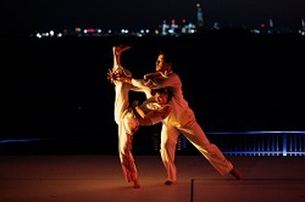 Rosa Allegra Wolf and Justin Rainey in Bill T. Jones’ “Curriculum IV: Spin and Spin! Turn! Turn! Turn!” at Robert F. Wagner Jr. Park